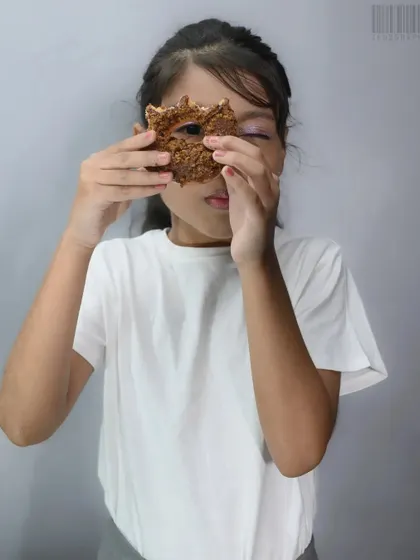 A playful shot from the same birthday series, with the girl peeking through a donut. This shows how I encourage kids to be themselves during a shoot to get natural and fun photos.