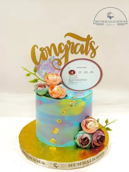 A cake to celebrate a social media milestone. This watercolour-effect cake with fresh flowers was ordered to celebrate a friend hitting 26.2k followers, showing that any achievement is worth celebrating with cake.