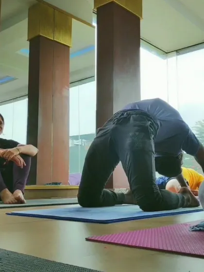 Working on Ustrasana (Camel Pose) in a group class. Even in a simple backbend, the right guidance can make it a much more effective and safe experience.