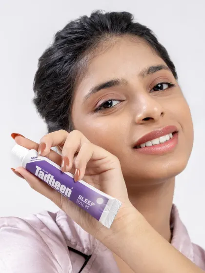A clean and simple beauty shot for the Tadheen campaign. The model holds the product close to her face, with a fresh and natural look that speaks to wellness.