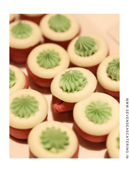 "Dainty. Decadent. Deliciously detailed." A close-up of our colourful, flower-like macarons, showcasing the precision and delicate artistry of our pastry team.