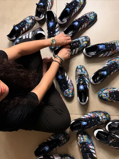An overhead shot of the nine pairs of custom Adidas Sambas I painted for a client. This view really shows the controlled chaos of the splatter art style across the entire collection.
