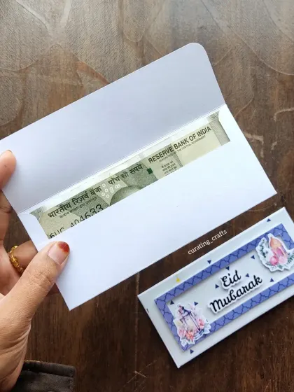 An Eidi envelope with a cash note, ready for gifting.