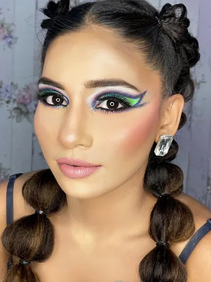 A hi-fashion makeup demo for my students. This look features bold, graphic shapes and a blend of vibrant colors, showcasing advanced techniques and creativity.