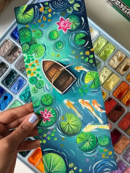 Holding up the finished vertical koi pond painting. The composition draws you into the scene, following the fish as they swim.