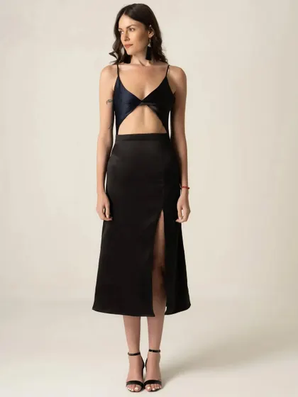 A full-length shot of a black cutout dress for a brand's new collection. Clean, consistent lighting and background are key for creating a professional online catalogue.