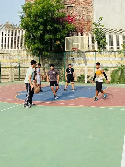 Players moving the ball up the court, focusing on quick and efficient passing.