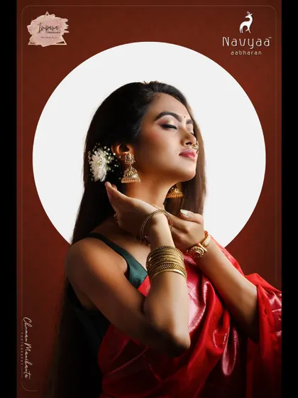 A creative photoshoot for a gold jewellery brand. The makeup is ethereal and glowing, designed to highlight the exquisite handcrafted jewellery.