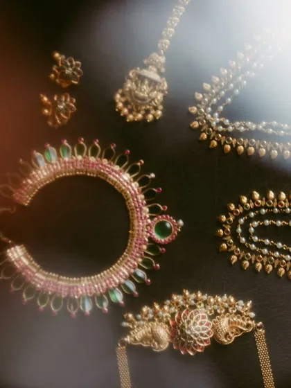 A beautifully lit shot of traditional South Indian bridal jewelry, capturing the intricate details and heritage of the pieces.
