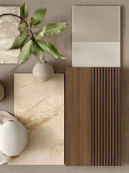 A refined play of textures and tones. This material board captures the calm, grounded essence of our design philosophy, featuring natural stone, warm wood finishes, and soft fabric swatches that reflect our commitment to timeless, earthy elegance.