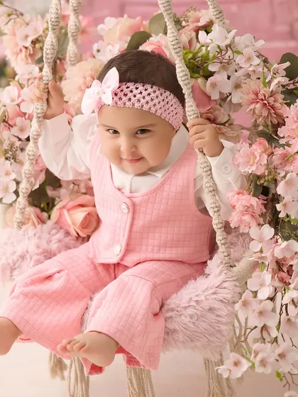 A portrait of sweetness on our pink floral swing. This setup is perfect for creating soft, dreamy, and artistic photos of your baby.