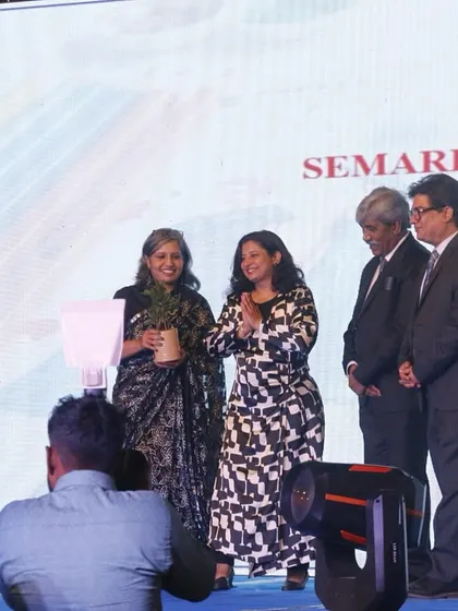 Our director and faculty members honor a representative from a partner organization on stage.