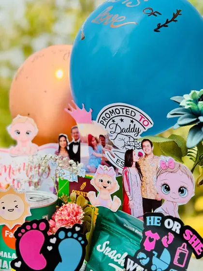 A closer look at the personalized details in my "Parents to be" hamper. I include the couple's photos and fun stickers like "Promoted to Daddy" to make the gift extra special and memorable.
