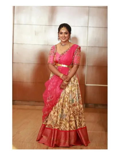 The full ensemble of the Kalamkari print half saree, showing how the different elements come together to create a balanced and beautiful traditional outfit.
