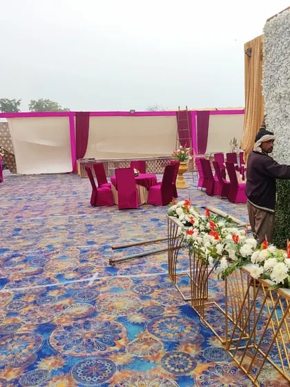 Here my team is setting up a floral wall for a wedding reception. This behind the scenes look shows the practical work that goes into building the beautiful backdrops for your event.