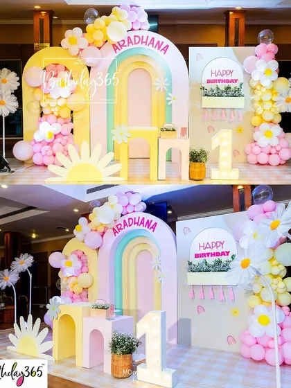 We brought a field of daisies indoors for Aradhana's first birthday. This "daisy paradise" featured a pastel rainbow arch, large daisy props, and a light-up number "1".