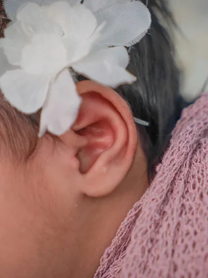 The tiniest details are often the most precious. I always make sure to capture close-ups of features like their delicate ears and soft hair.