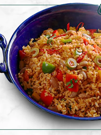 This colorful Mexican-style rice bowl is packed with beans, corn, and fresh vegetables. It's a flavorful and hearty meal that brings a little fiesta to your day.