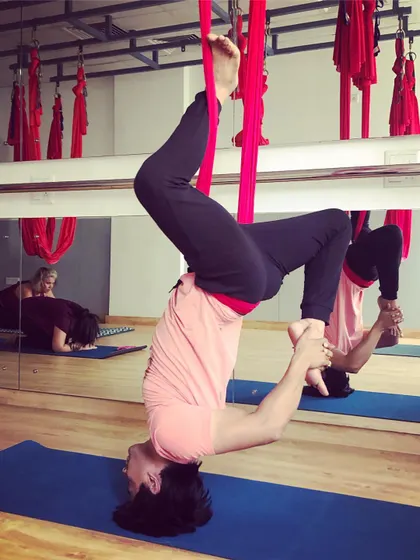Yes, men can and absolutely do enjoy aerial yoga. It's a fantastic practice for anyone looking to improve flexibility and core strength, especially for those who do intensive workouts like weightlifting.