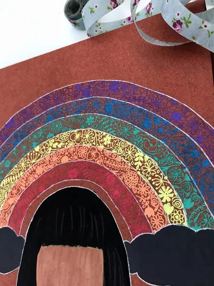 A detailed look at the intricate, gel-pen doodles that make up each color of the rainbow on the birthday card. Pulling an all-nighter to get these details right was completely worth it.