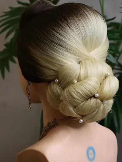 The knot bun is an excellent choice for clients with medium to short length hair. I teach techniques to make it look full and intricate, regardless of hair length.