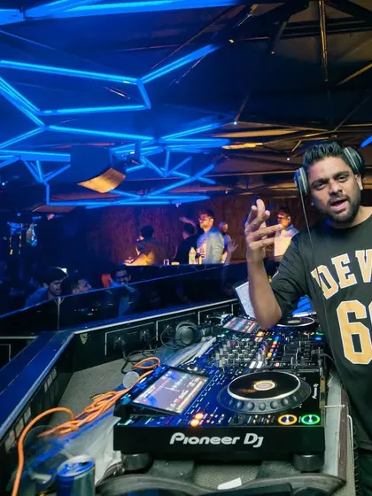 Taking charge of the console at Hex, Mumbai. The club's futuristic lighting and design provide the perfect setting for my mix of Bollywood, Hip Hop, and Trap music.