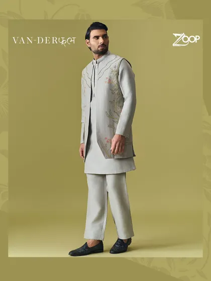 A sophisticated grey layered kurta set from the Vanderphool collection. The subtle floral embroidery on the jacket adds a touch of artistry to the monochromatic look.