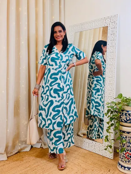 A fun and artistic co-ord set with a green abstract print. This is a great outfit for a creative workplace or a casual day out.