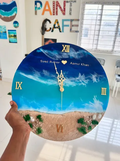 Another view of the personalized beach resin clock, showing the beautiful details of the sand, shells, and resin waves.