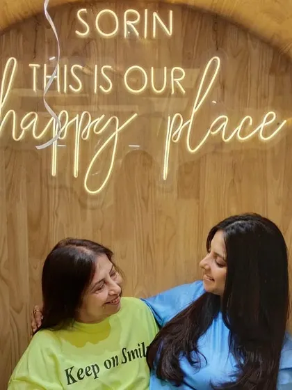 Another beautiful moment between a mother and daughter, captured under our "happy place" sign.