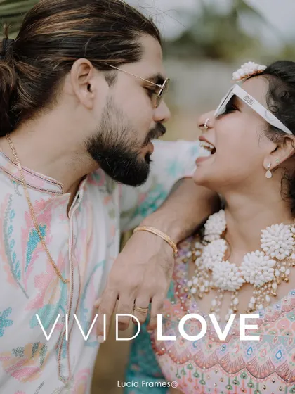 "Vivid Love." A close-up of the couple laughing, perfectly capturing the spirit of their colorful celebration.