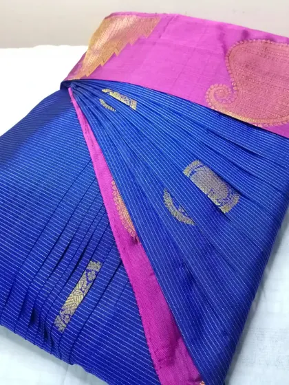A classic blue and pink combination. This saree is now pre-pleated and ready to be worn for any occasion, hassle-free.