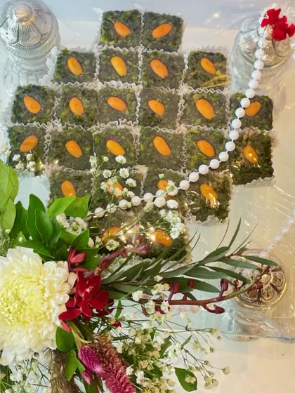 An exquisite wedding hamper featuring traditional Indian sweets (mithai) and decorative elements, perfect for celebrating love and tradition.