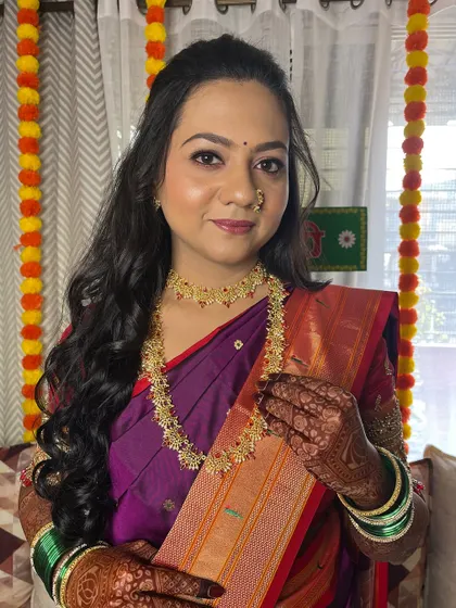 A happy portrait of the bride, ready for her engagement ceremony.