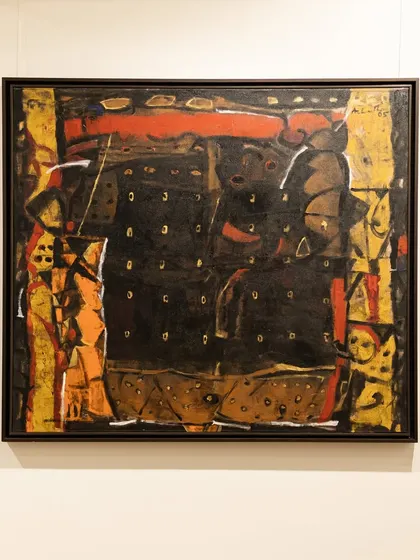 'Untitled (Black)' from 2005 by Achutan Kudallur, a pioneer in Indian abstraction. Abstract symbols emerge from the darkness, reminiscent of cave etchings, creating an immersive quality of mystery and quiet intensity.