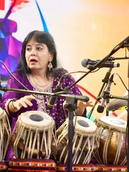 Explaining a rhythmic concept during my performance for corporate leaders and dignitaries. My goal is to make Indian classical music accessible and demonstrate its practical applications for focus, creativity, and stress management in a professional environment.