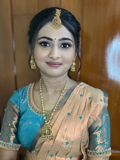 A close-up of her soft glam makeup. The look is subtle enough for a day event but still feels special.