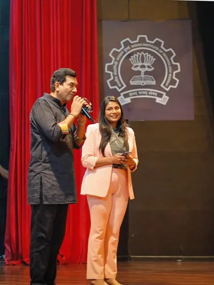 A fan moment on stage with Chef Sanjeev Kapoor at IIT Bombay. My interview style is conversational, aiming to reveal the person behind the public persona.
