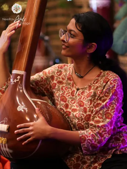 A duplicate of my portrait with the tanpura, emphasizing my deep connection to the roots of Indian music. This is the foundation of my vocal artistry.