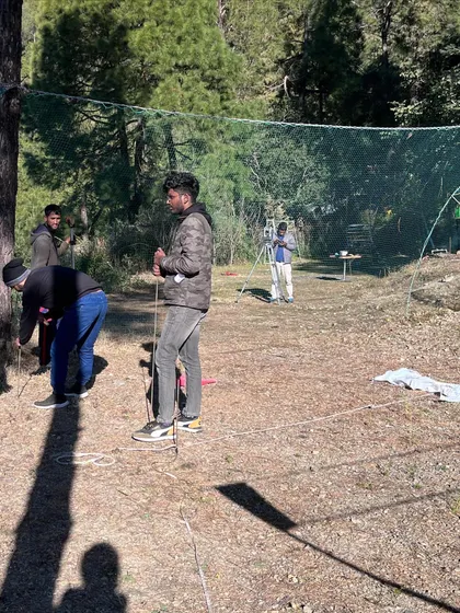 The very first step of any project is understanding the site. Here, my team is on the ground in a pine forest, meticulously surveying and marking out the land to ensure the future structure aligns perfectly with the terrain and existing trees.