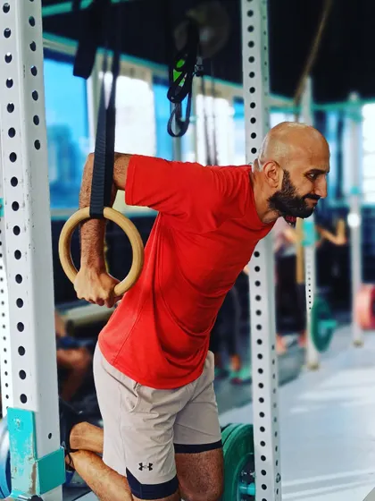 Ring dips are a challenging progression that requires significant stability and strength. This member demonstrates excellent control during the movement.
