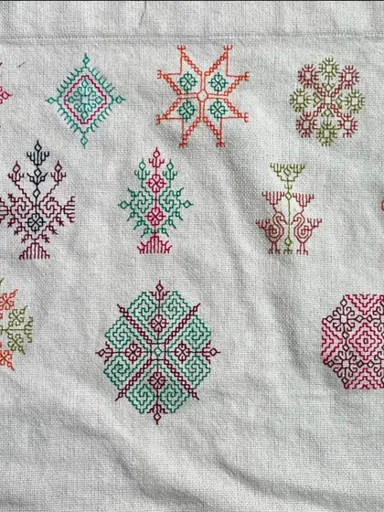 A sampler of various Kasuti motifs. I often create these to explore new color combinations and patterns. Each small design is a testament to the versatility of this counted-thread technique.