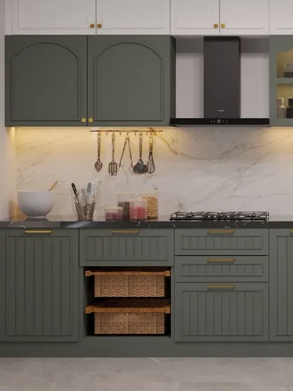 A view of the cooking area in the olive green kitchen, featuring a marble backsplash and a utensil rail for easy access.