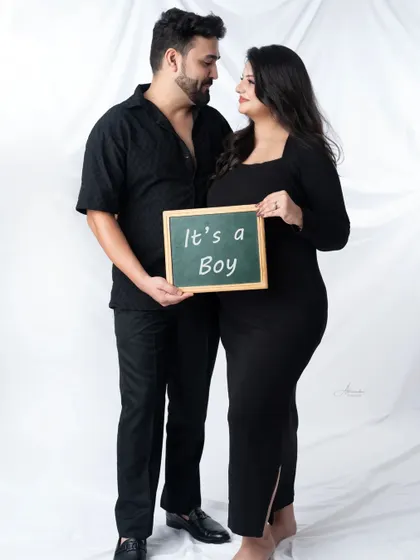 Announcing the big news with a chalkboard sign. This is a simple and classic way to share that "It's a Boy!"