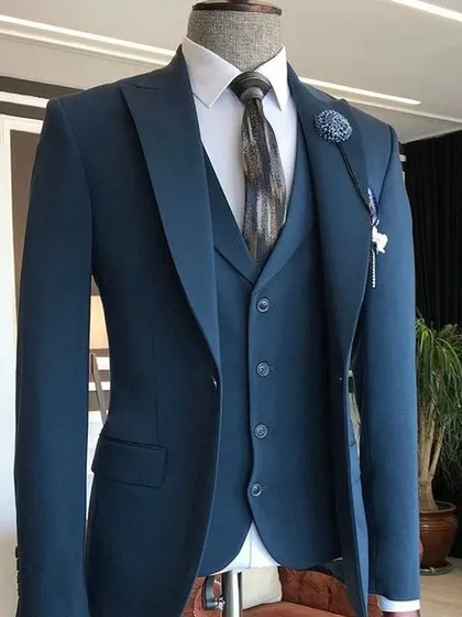 A single-breasted suit in a modern teal blue. It's a stylish alternative to the classic navy or black suit.