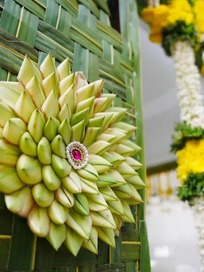 The difference is in the details. This close-up shows our intricate craftsmanship using natural coconut leaves, a traditional art form we use to add a unique and authentic touch to our event decorations.