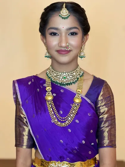 A lovely portrait of a young client looking radiant in her traditional attire. The makeup is fresh and minimal, enhancing her natural beauty.