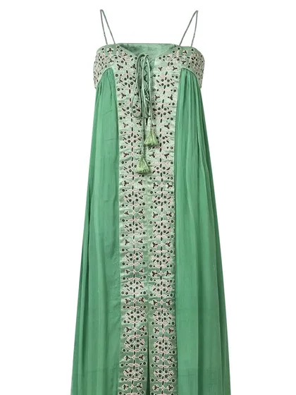 The front view of a green spaghetti-strap maxi dress with intricate embroidery, shot on a white background to emphasize the garment's details and silhouette.