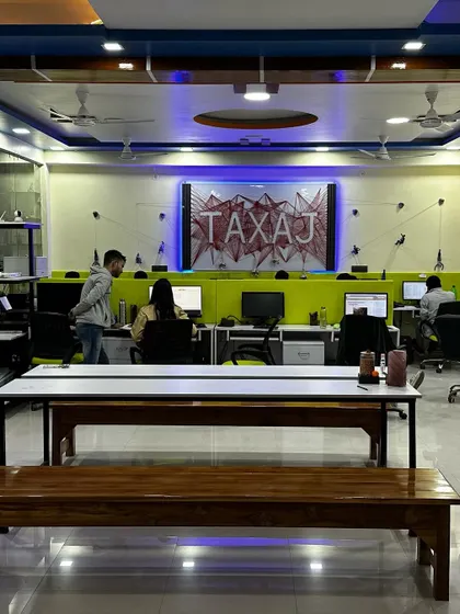 A glimpse into our new workspace where our team collaborates to manage your compliance needs. We've created a modern and energetic environment to foster innovation and deliver the best service to you.