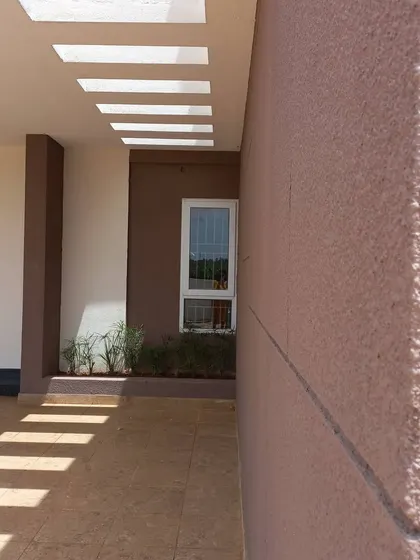 A different angle of the walkway, showing how the light patterns move and change, and how the textured exterior wall catches the light. These small details bring a building to life throughout the day.
